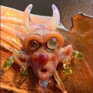 Artist-signed creature pendant glass